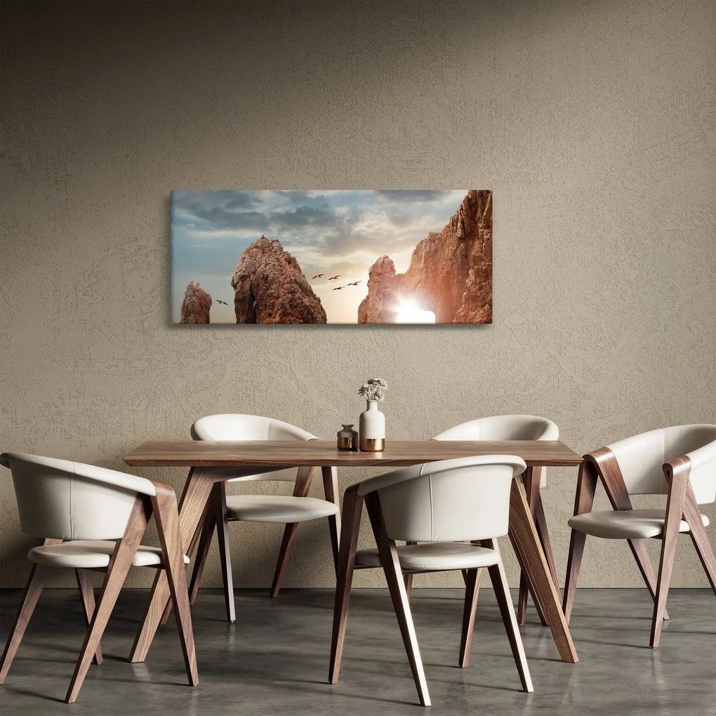 Tablou - Apus de soare peste stânci (120x50 cm)