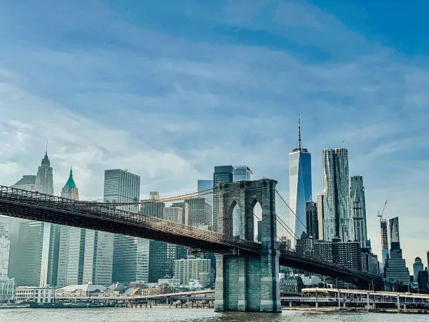 Fotografie View of skyscrapers against cloudy sky,New, bamsgirl411 / 500px