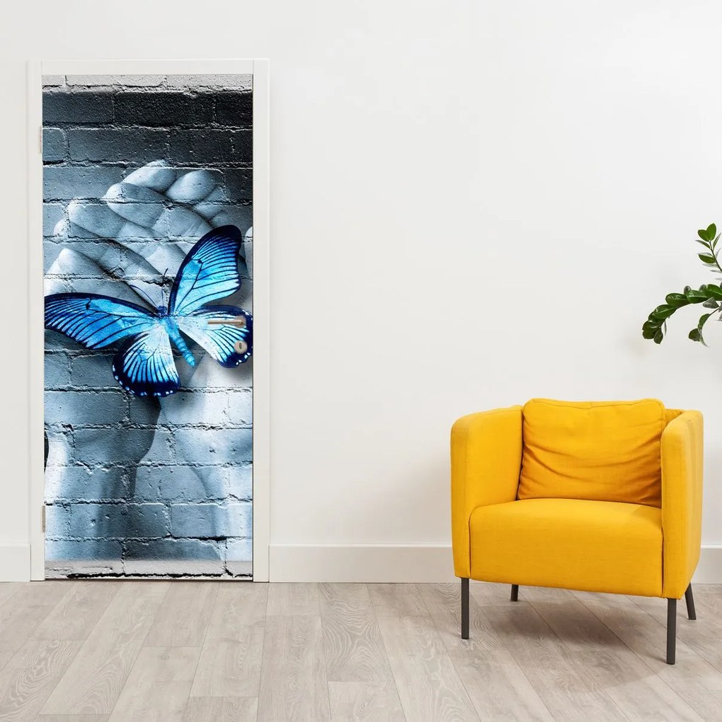 Fototapet pentru ușă - Fluture albastru pe perete (95x205cm)