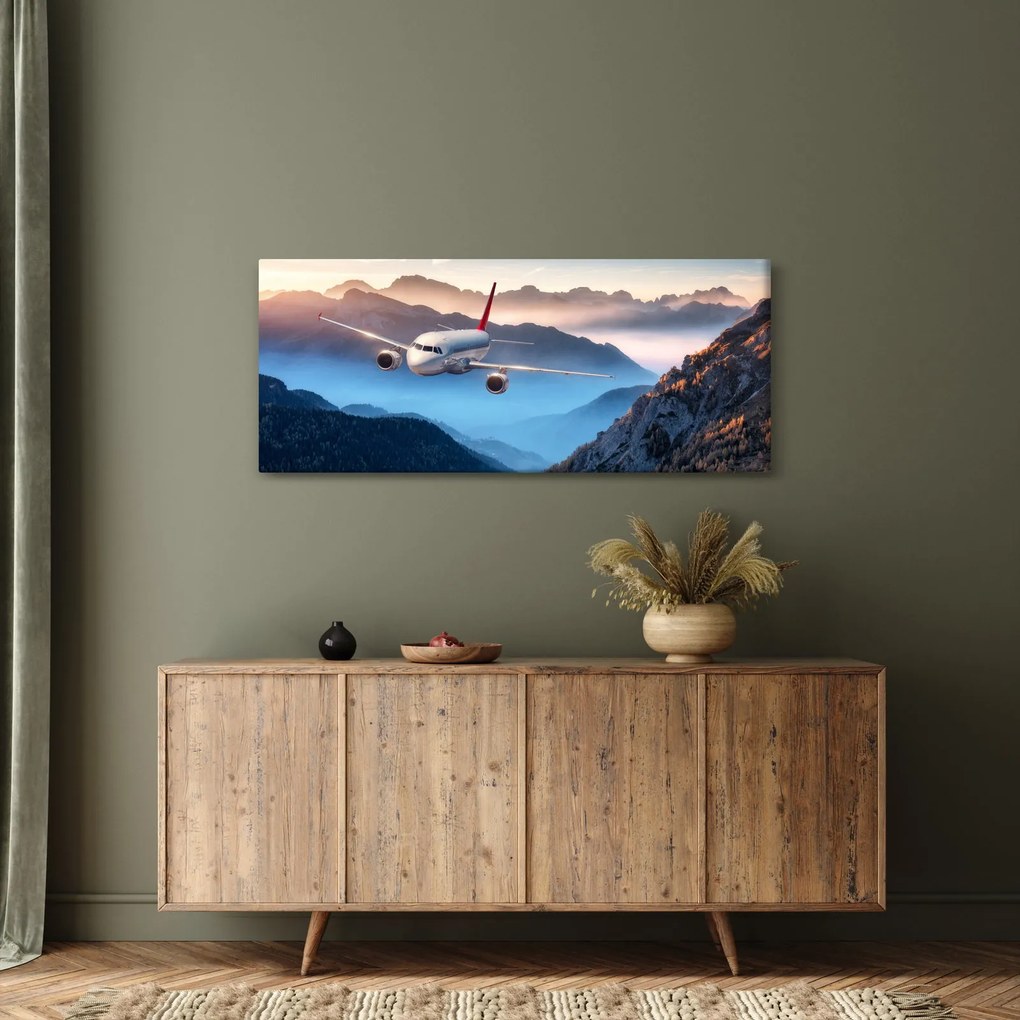 Tablou - Avion peste crestele montane (120x50 cm)