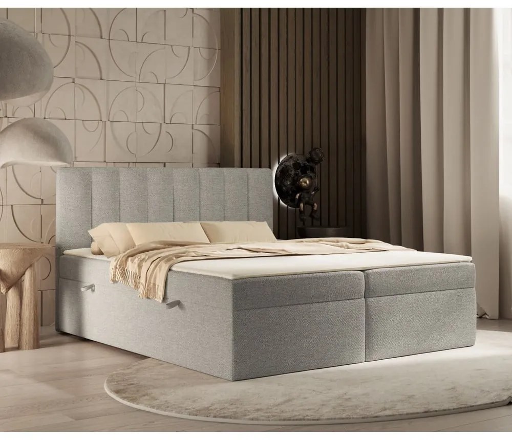 Pat boxspring gri deschis cu spațiu de depozitare 180x200 cm Novento – Maison de Rêve