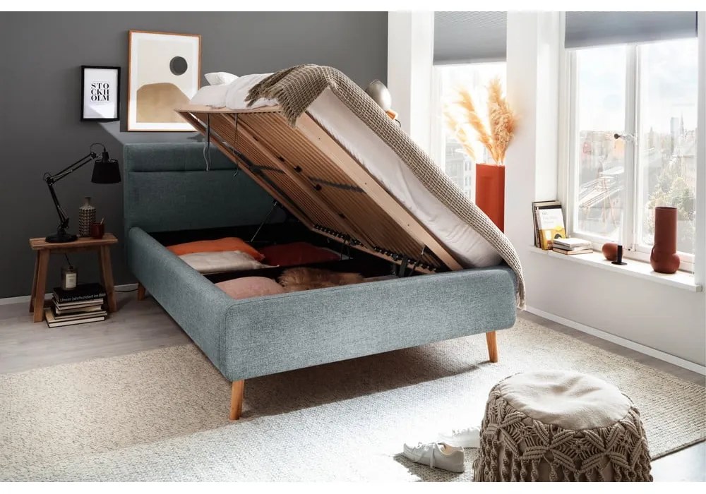 Pat matrimonial albastru prăfuit tapițat cu spațiu de depozitare cu somieră 140x200 cm Lotte – Meise Möbel