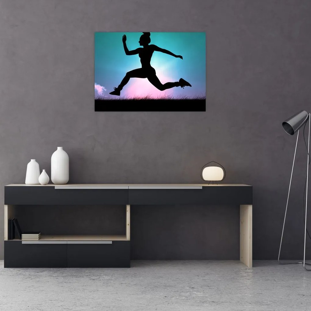 Tablou pe sticlă cu silueta feminină sărind (70x50 cm)