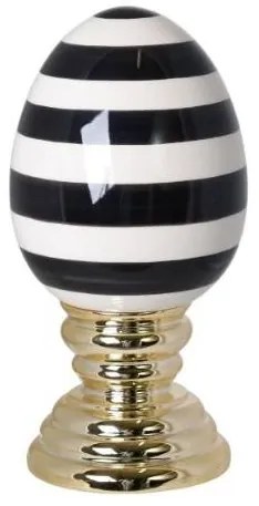 Ou mare cu dungi albe si negre pe un suport auriu din ceramica