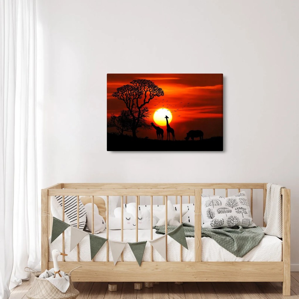 Tablou - Siluete animalelor la apus de soare (90x60 cm)