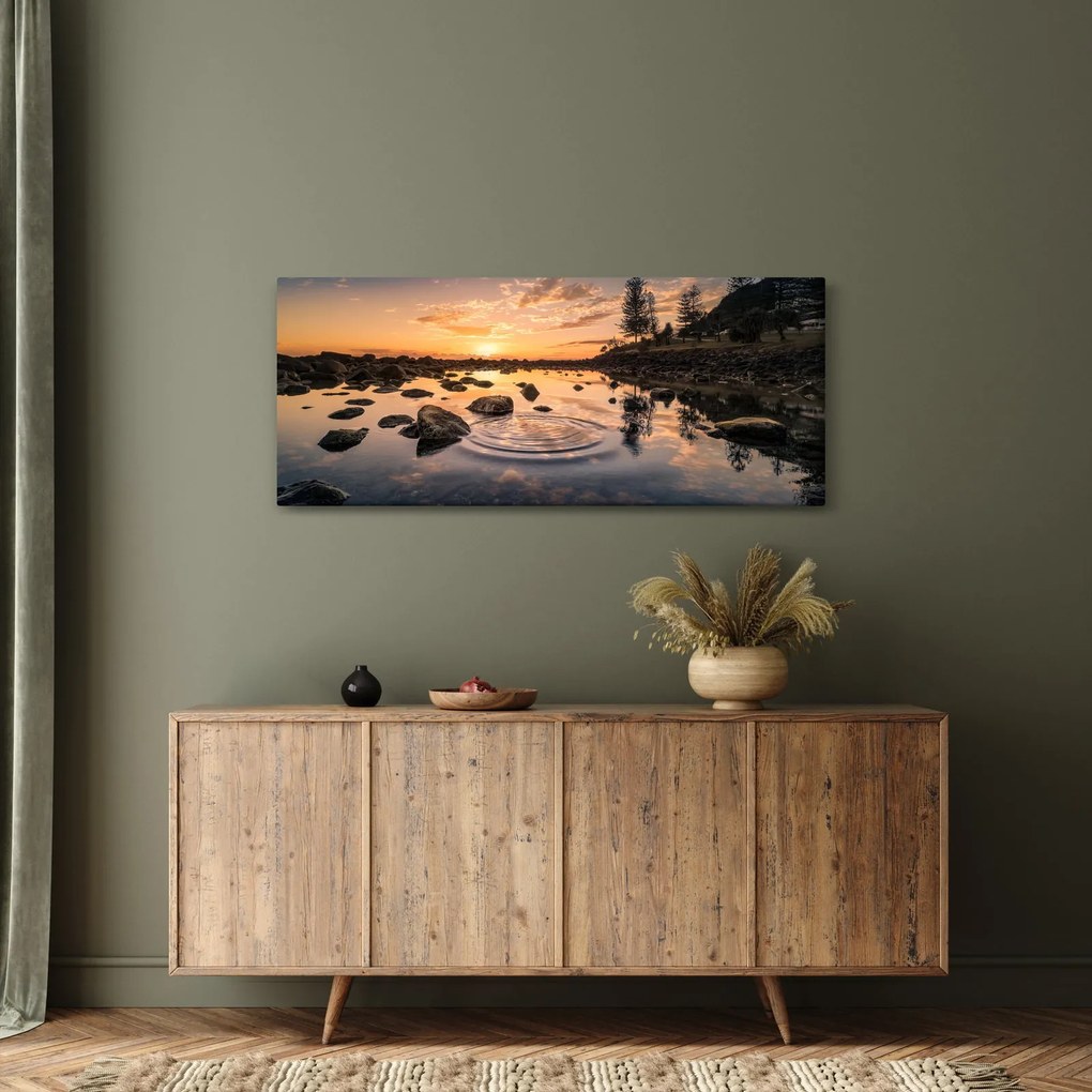 Tablou - Suprafața apei la apus de soare (120x50 cm)