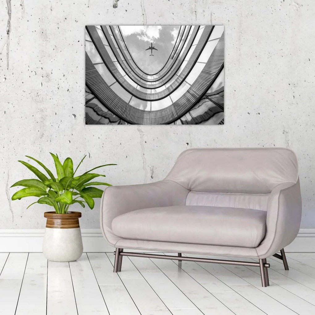 Tablou pe sticlă - Avionul deasupra clădirii (70x50 cm)