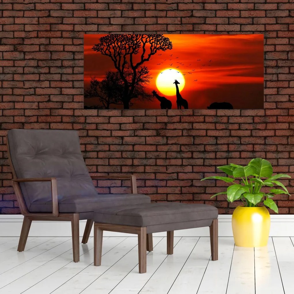 Tablou - Siluete animalelor la apus de soare (120x50 cm)
