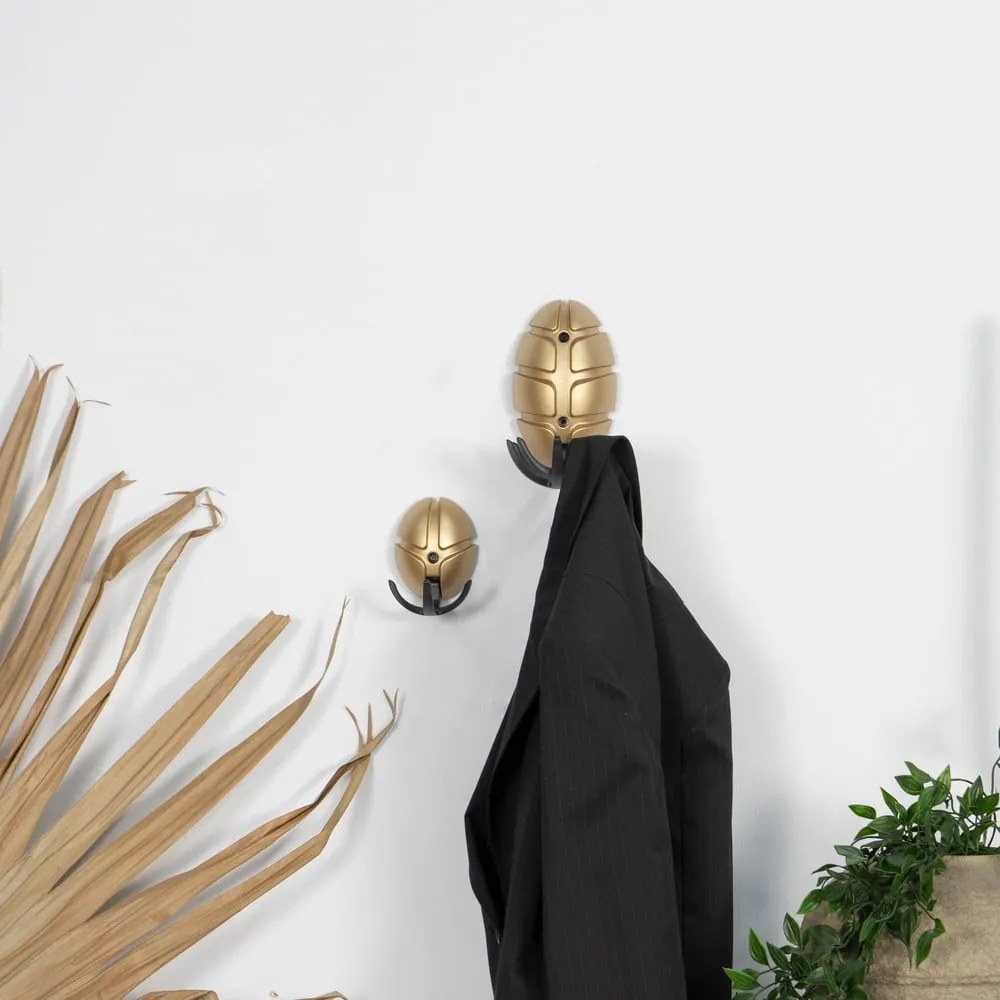 Cârlig negru/auriu de montat pe perete din plastic Tick – Spinder Design