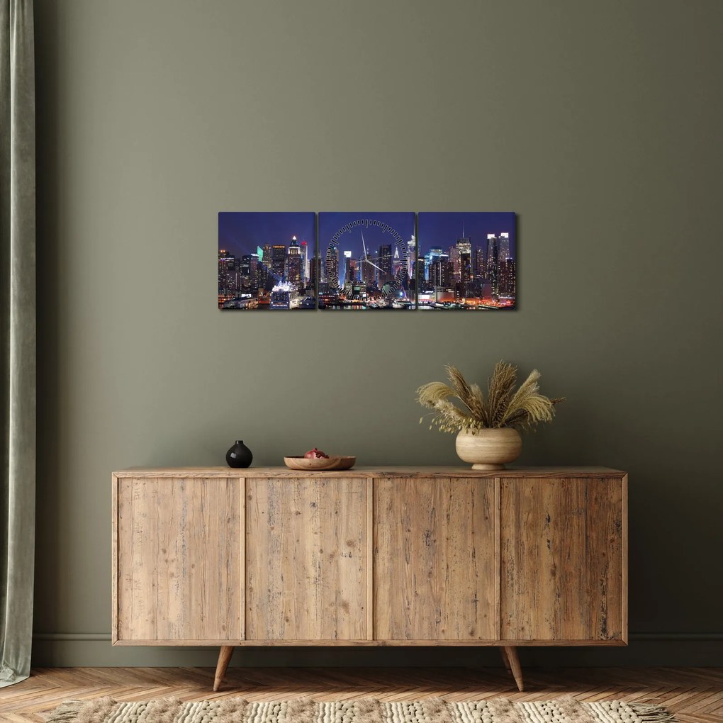 Tablou - Zgârie-nori din New York iluminate (cu ceas) (90x30 cm)