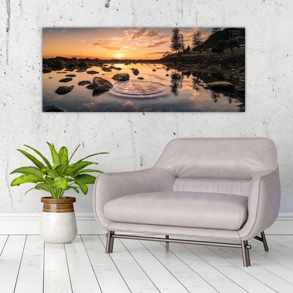 Tablou - Suprafața apei la apus de soare (120x50 cm)