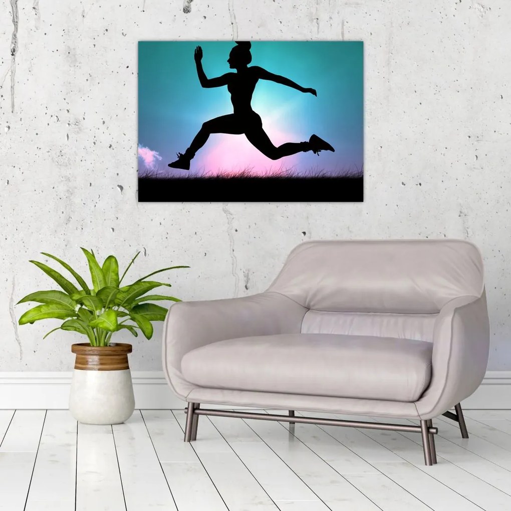 Tablou pe sticlă cu silueta feminină sărind (70x50 cm)