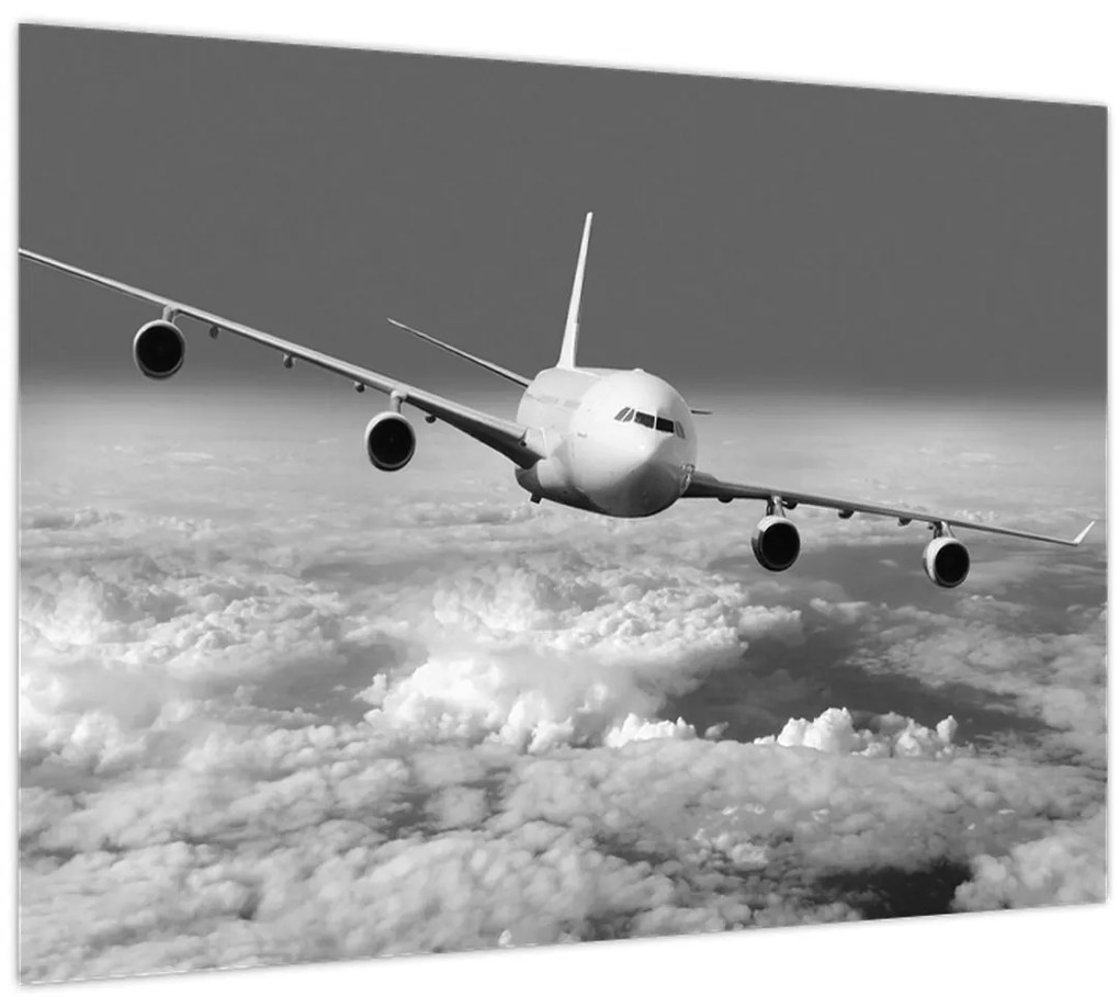 Tablou pe sticlă - Avion în nori, alb și negru (70x50 cm)