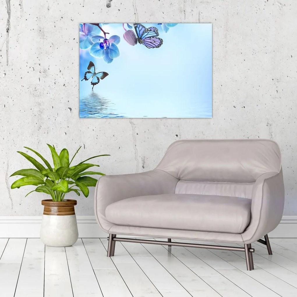 Tablou pe sticlă - Fluture pe flori de orhidee, albastru (70x50 cm)