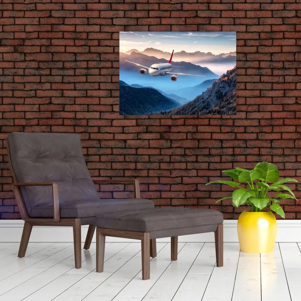 Tablou pe sticlă - Avion peste crestele montane (70x50 cm)