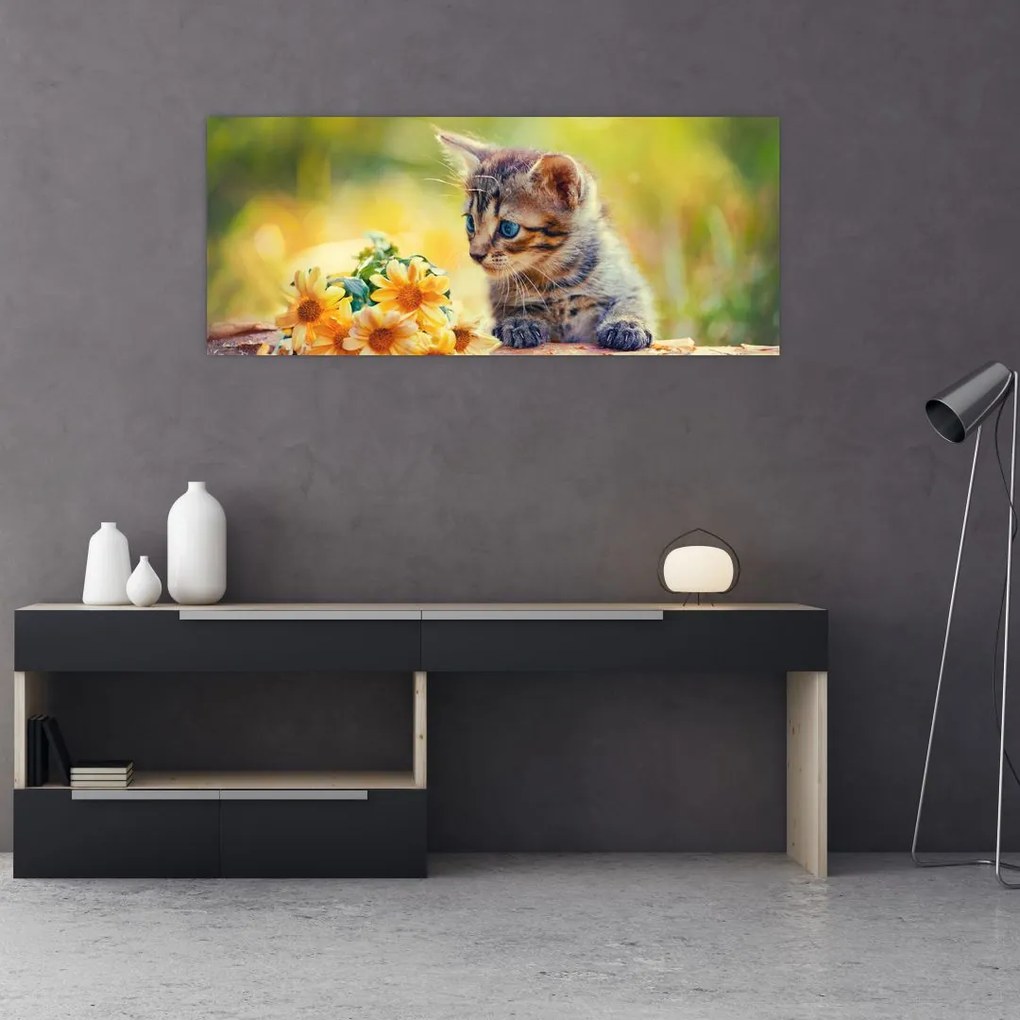 Tablou cu pisicuța uitându-se la floare (120x50 cm)