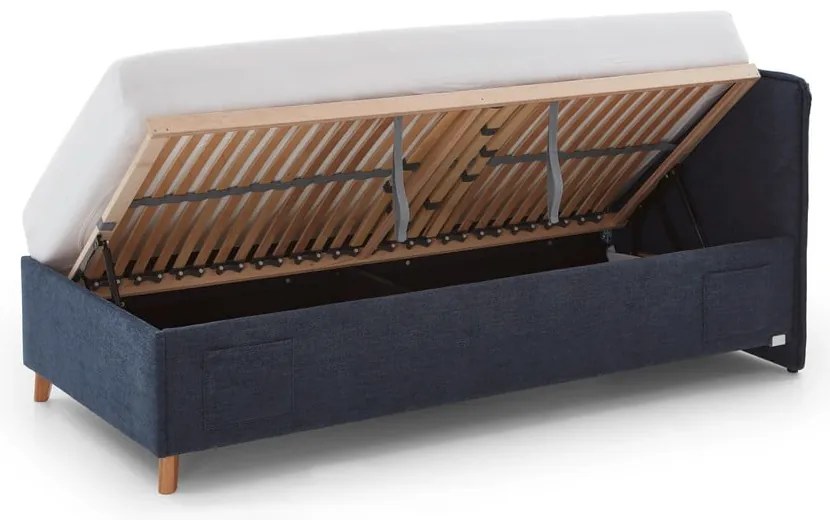 Pat pentru copii albastru închis tapițat cu spațiu de depozitare cu somieră 120x200 cm Fun – Meise Möbel