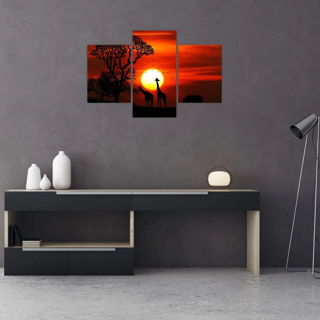 Tablou - Siluete animalelor la apus de soare (90x60 cm)