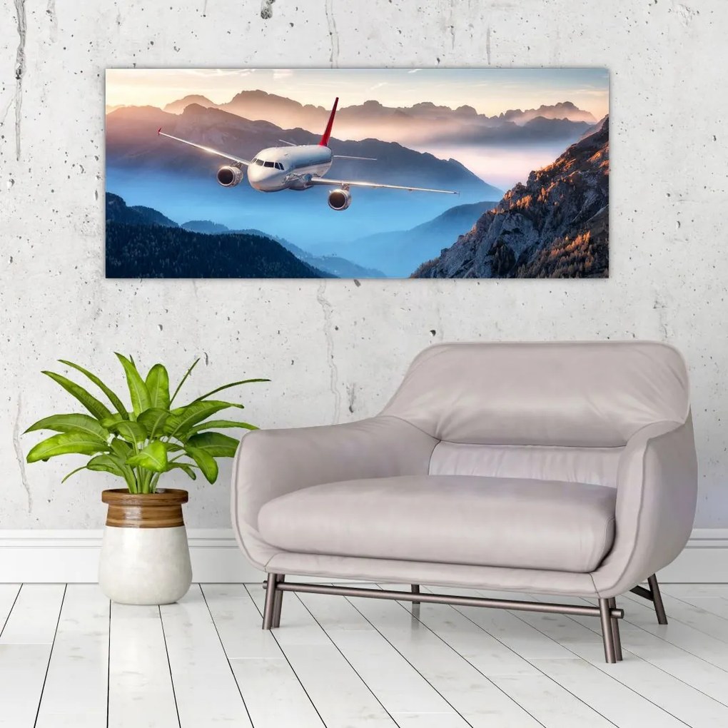 Tablou - Avion peste crestele montane (120x50 cm)