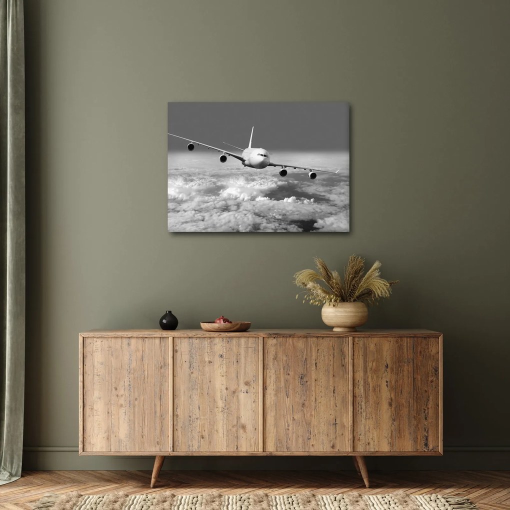 Tablou - Avion în nori, alb și negru (70x50 cm)