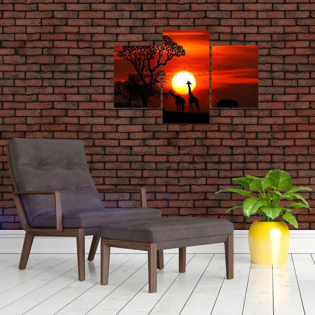 Tablou - Siluete animalelor la apus de soare (90x60 cm)