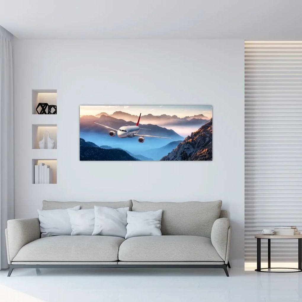 Tablou - Avion peste crestele montane (120x50 cm)