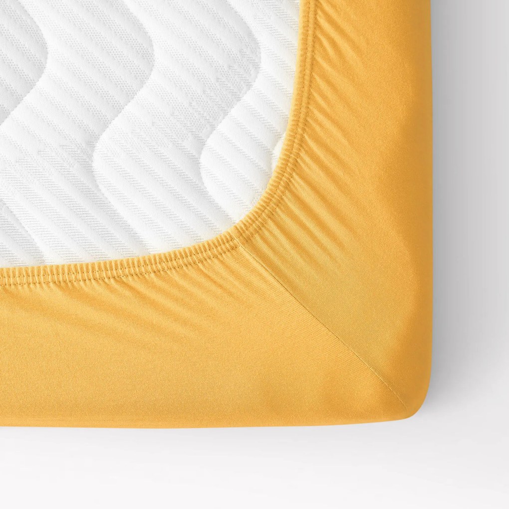 Goldea cearceaf pentru pătuț din jersey cu elastic - mango 60 x 120 cm