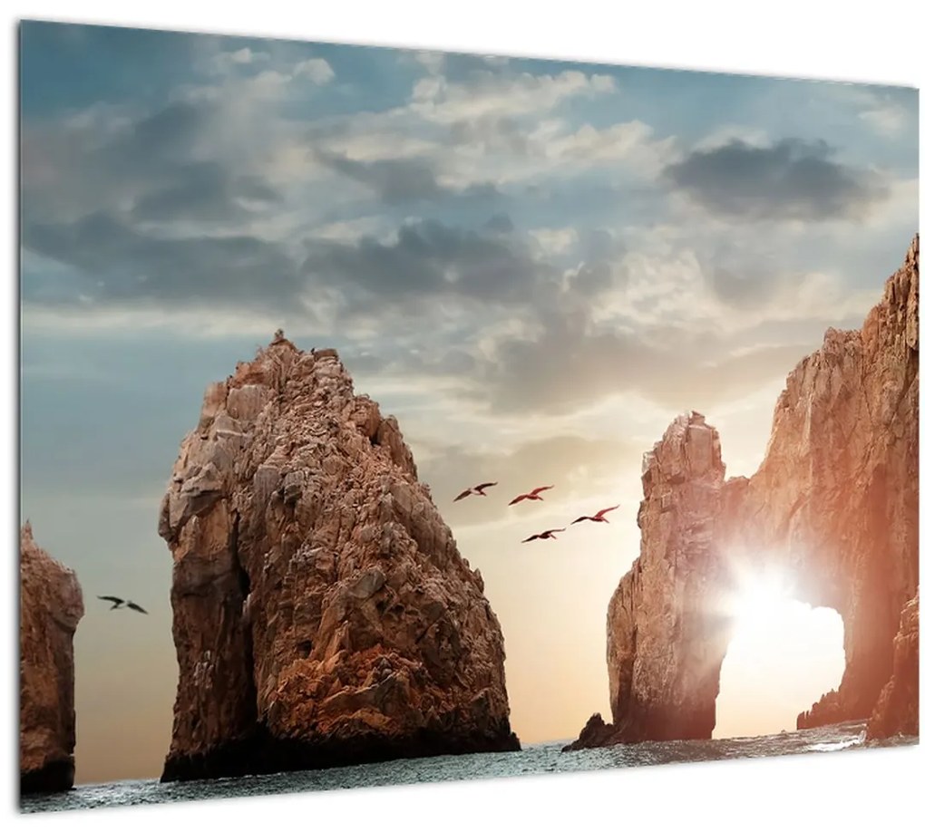 Tablou pe sticlă - Apus de soare peste stânci (70x50 cm)