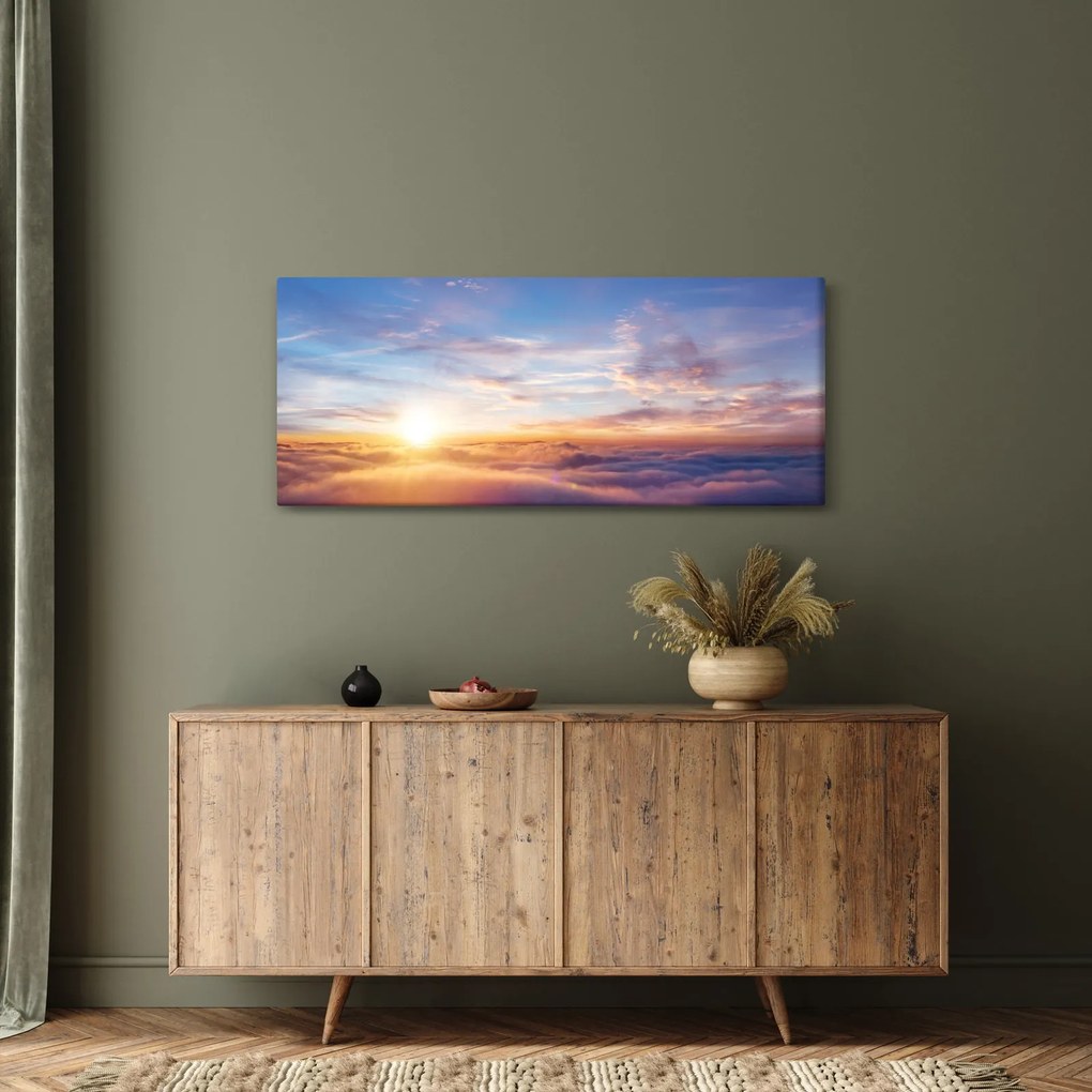 Tablou - Apus de soare deasupra norilor (120x50 cm)
