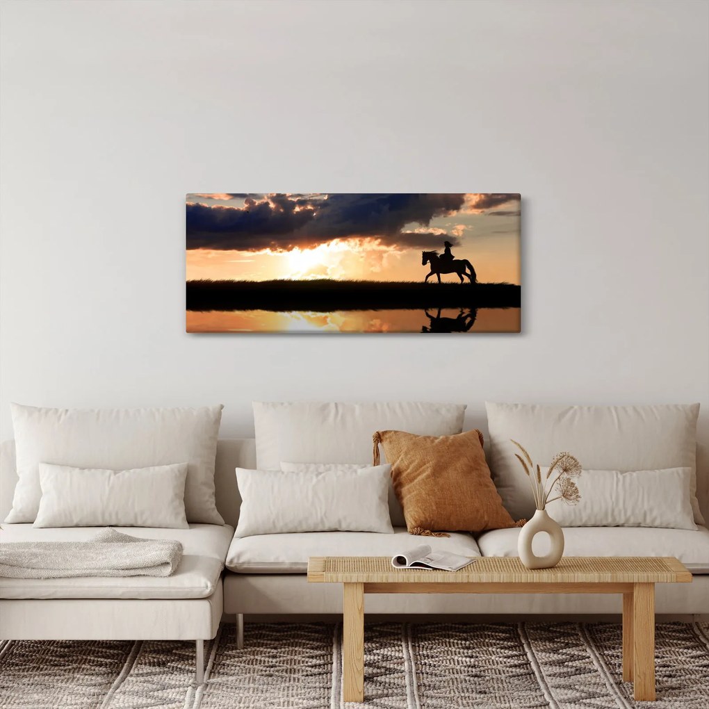 Tablou - Rider pe un cal la apus de soare (120x50 cm)