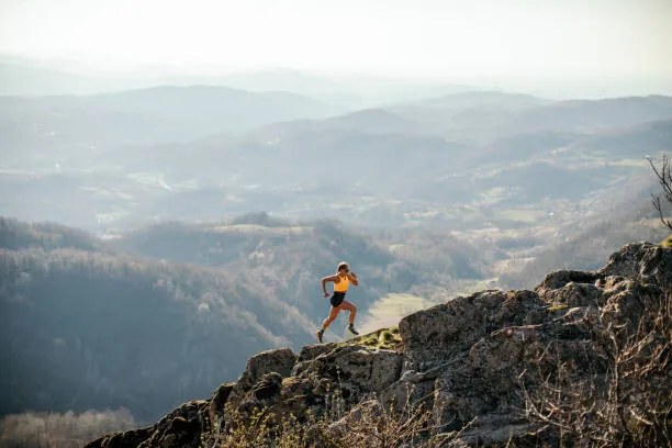 Fotografie Woman running on mountain, miljko