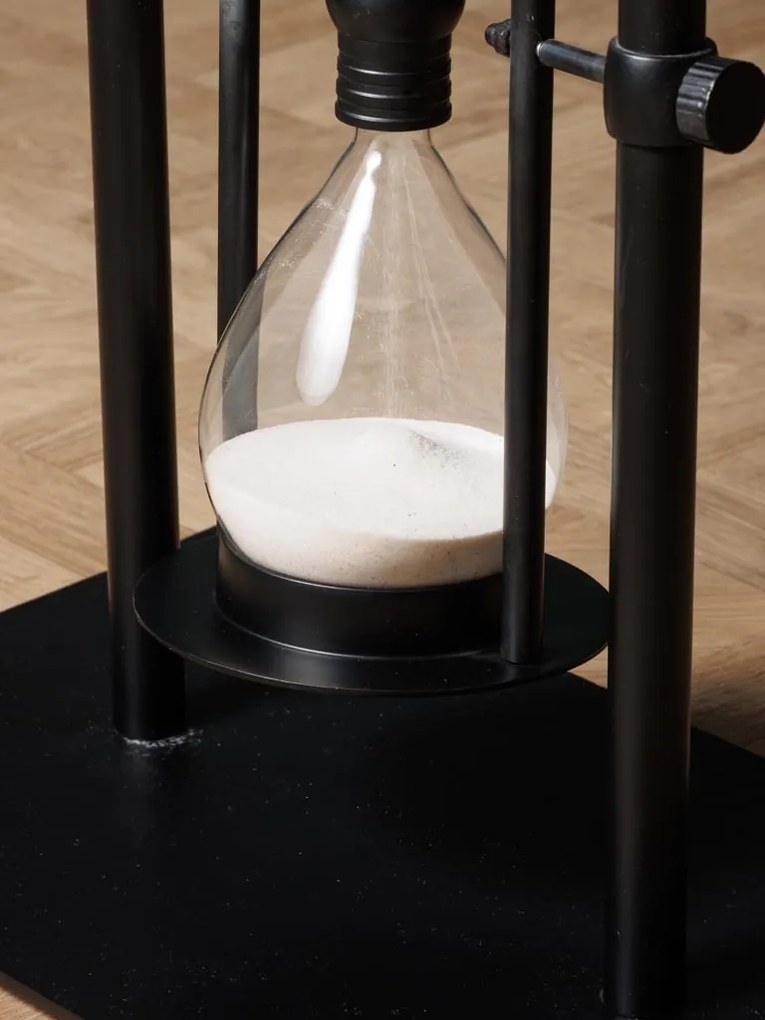 Măsuță laterală îngustă din metal, negru, cu clepsidră din sticlă pe pivot, 60 x 50 x 30 cm, „Time traveler”
