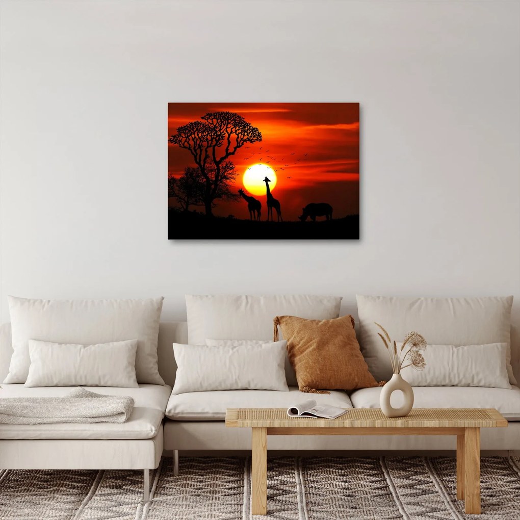 Tablou - Siluete animalelor la apus de soare (70x50 cm)