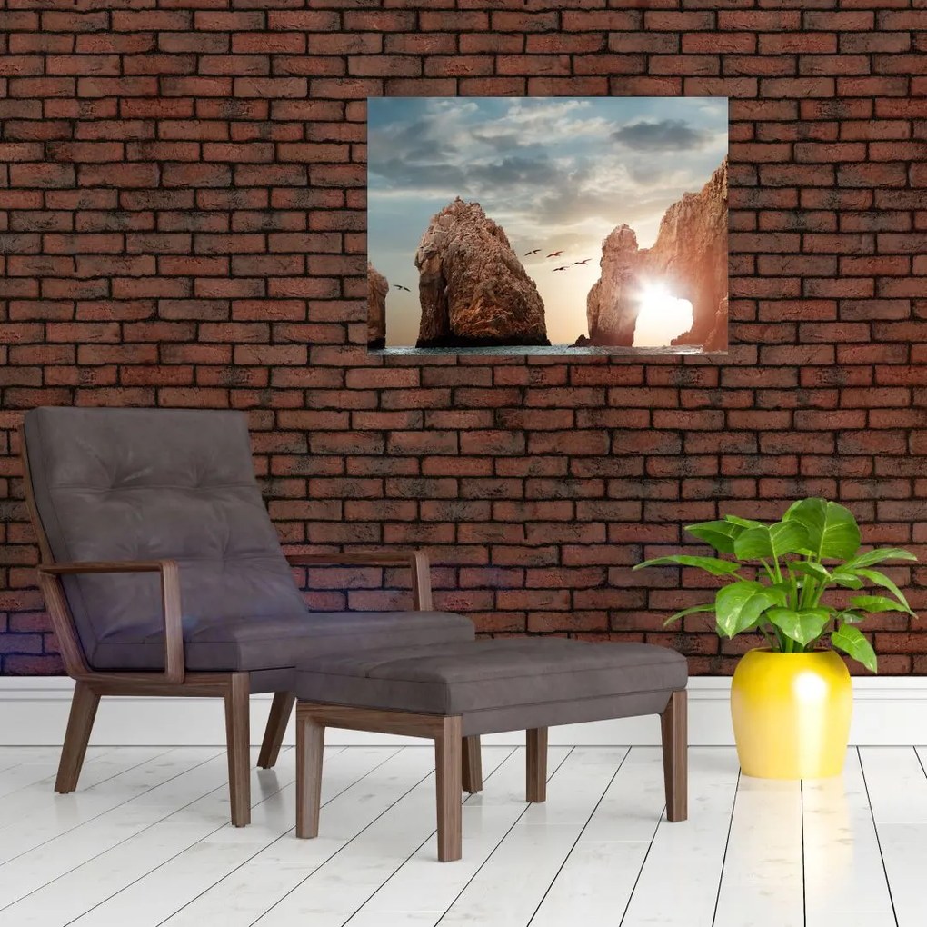 Tablou pe sticlă - Apus de soare peste stânci (70x50 cm)