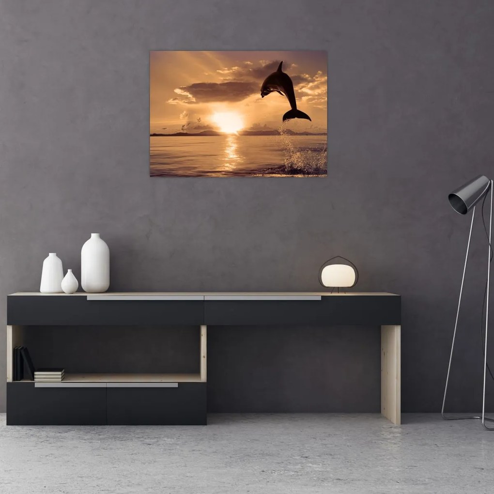 Tablou pe sticlă - Delfin la apus de soare (70x50 cm)