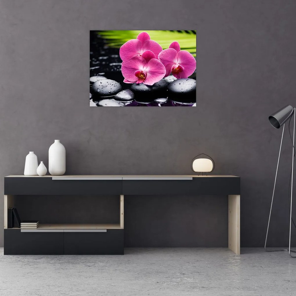 Tablou pe sticlă - Orhidee roz cu frunze de palmier (70x50 cm)