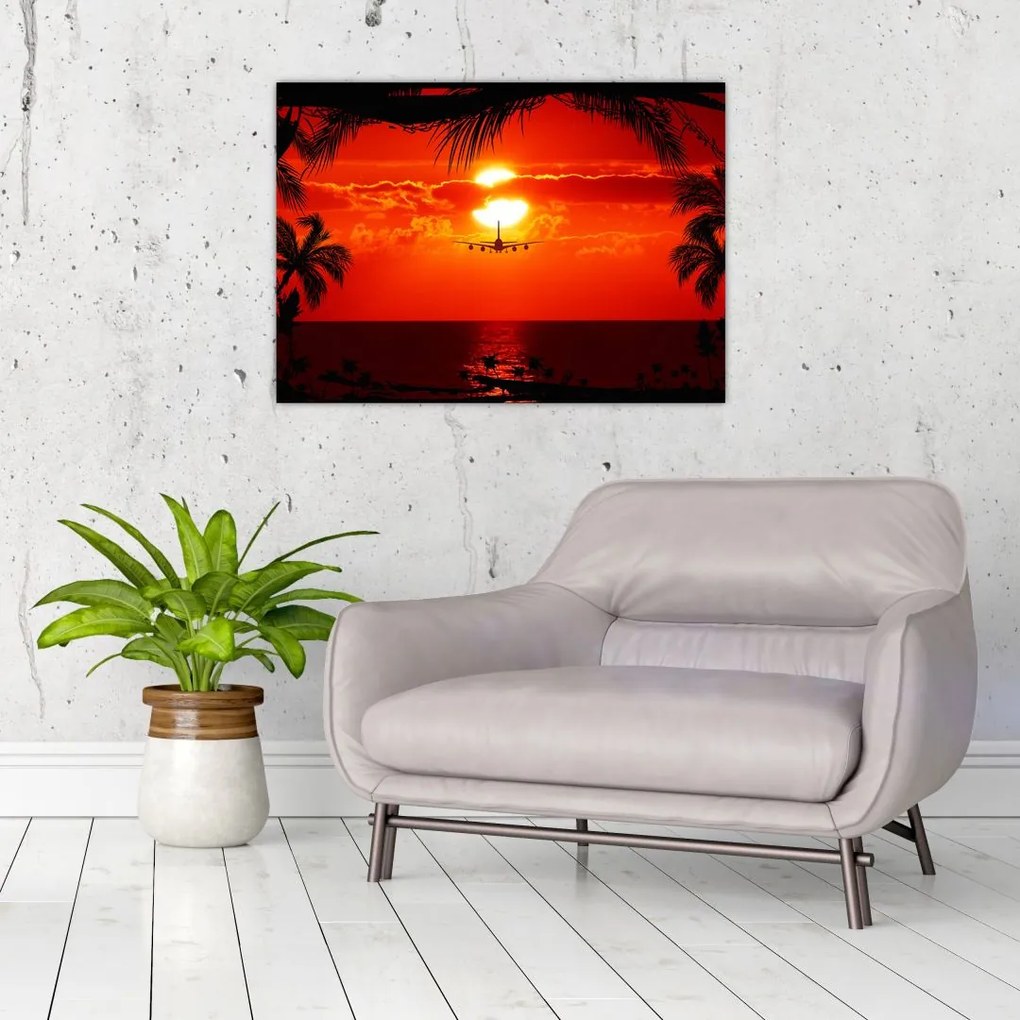 Tablou pe sticlă - apus de soare cu avion (70x50 cm)