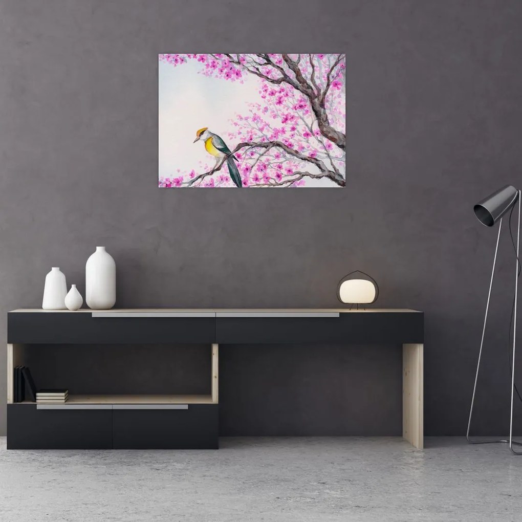 Tablou pe sticlă - Pasăre pe un copac cu flori roz (70x50 cm)