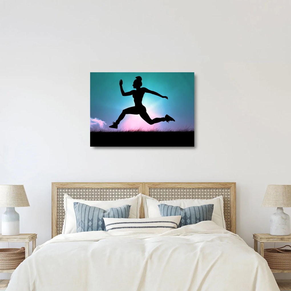 Tablou pe sticlă cu silueta feminină sărind (70x50 cm)