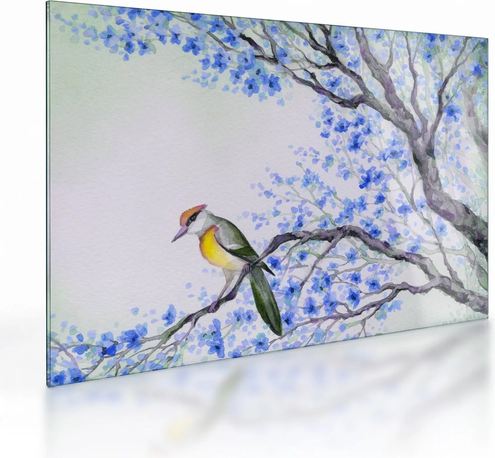 Tablou pe sticlă - Pasăre pe un copac cu flori albastre (70x50 cm)