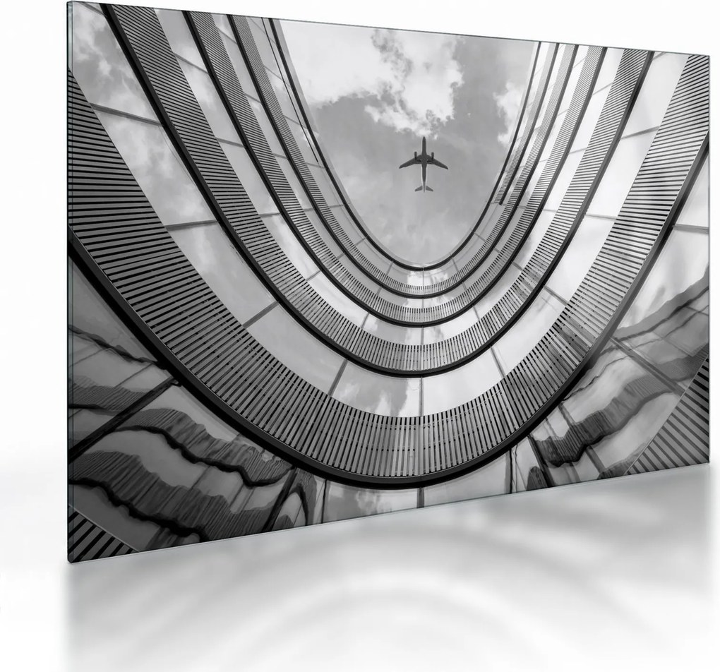 Tablou pe sticlă - Avionul deasupra clădirii (70x50 cm)