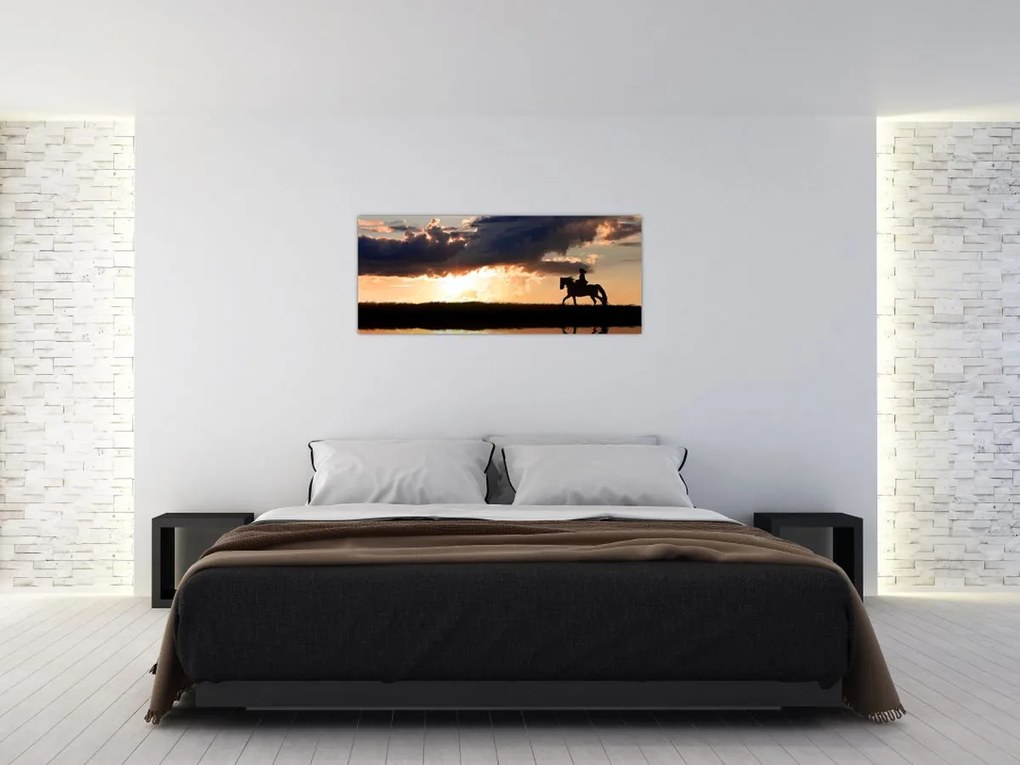 Tablou - Rider pe un cal la apus de soare (120x50 cm)