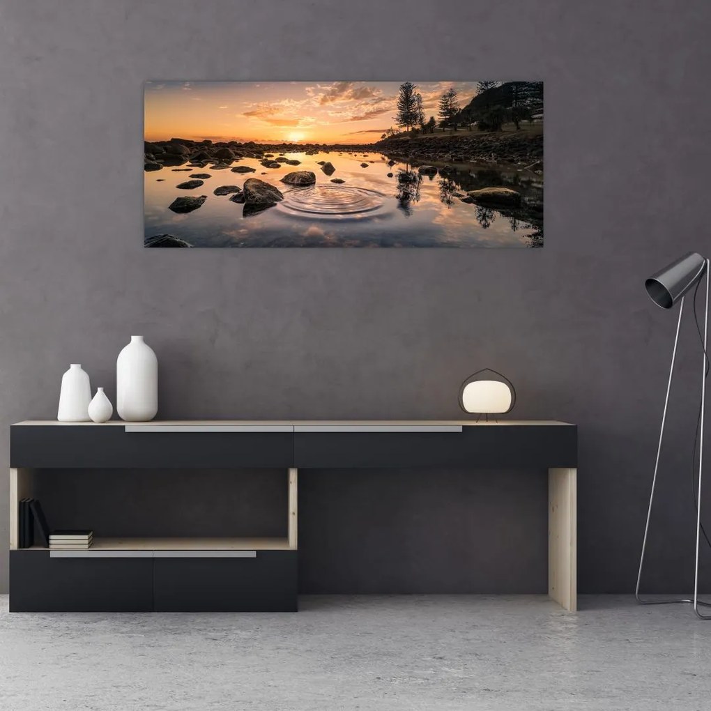 Tablou - Suprafața apei la apus de soare (120x50 cm)
