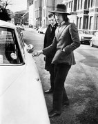 Fotografie Jagger, singer with the Rolling Stones, about to get into his car, c.1970