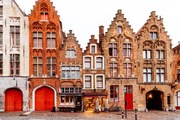 Fotografie Medieval houses standing in a row, Bruges, Belgium, Alexander Spatari