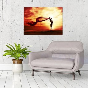 Tablou pe sticlă - Silueta femeii la apus de soare (70x50 cm)