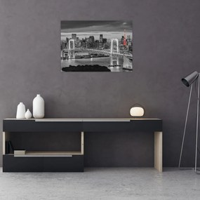 Tablou pe sticlă - Oraș mare cu un turn roșu (70x50 cm)