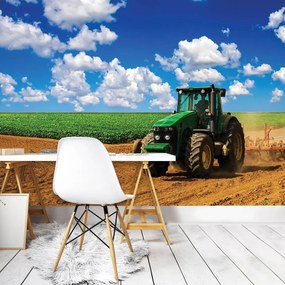 Fototapet - Tractor verde pe teren (254x184 cm)