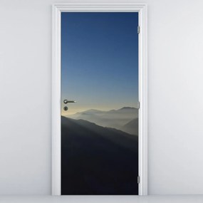 Fototapet pentru ușă - Desupra crestelor montane (95x205cm)