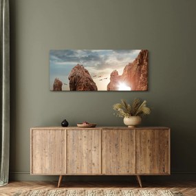 Tablou - Apus de soare peste stânci (120x50 cm)
